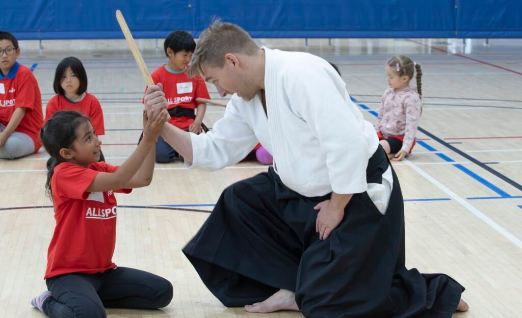 student and instructor practicing kotegaeshi in Calgary aikido class