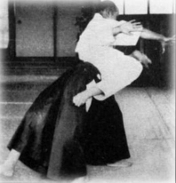 Aikidō founder Morihei Ueshiba demonstrating iriminage technique.